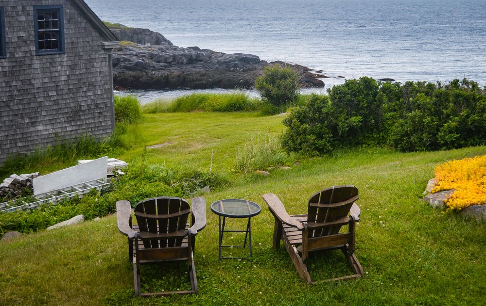 Wooden chairs overlooking the ocean at Monhegan Island