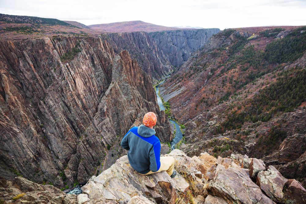 A hiker at the peak of Black Canyon of the Gunnison National Park