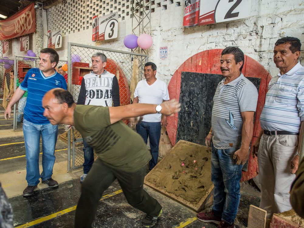Colombian men playing Tejo in a Tejo club