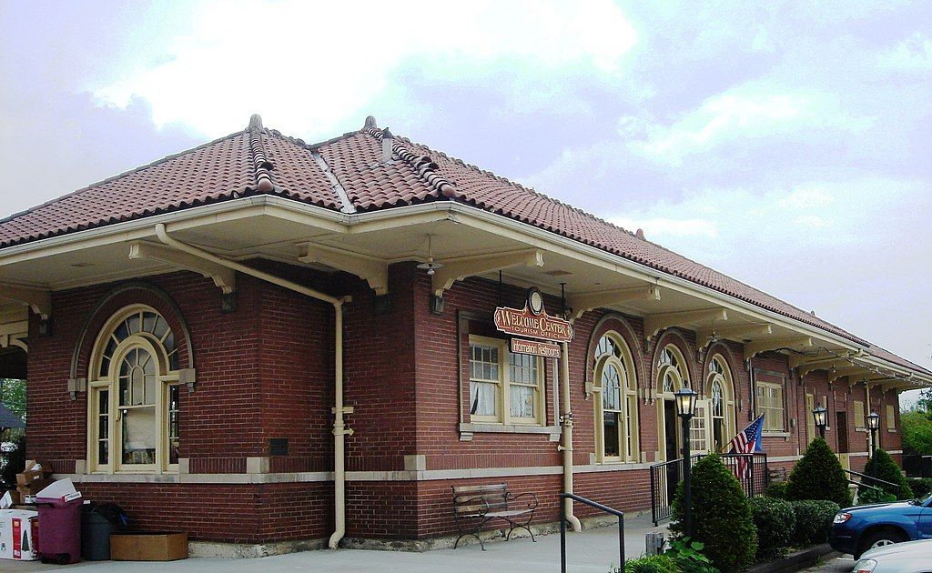 Exterior of the brea welcome center with red roof and brick walls.