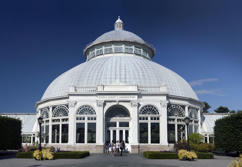 People walking in front of Haupt Conservatory