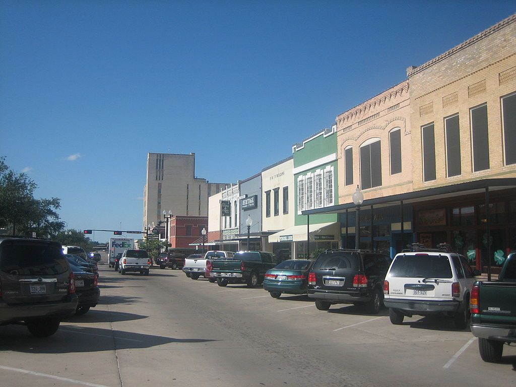 Downtown bryan cars and buildings.