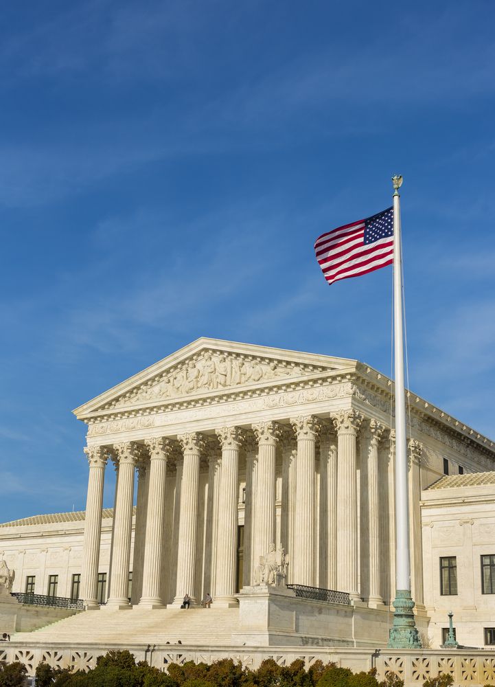 The U.S.A flag in front of U.S. Supreme Court