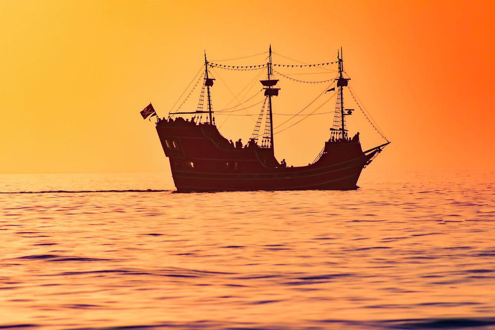 Captain Memo’s Pirate Cruise on the waters during sunset