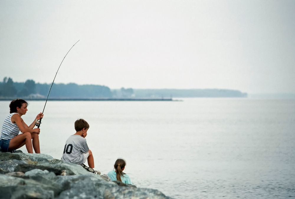 A family fishing at Point Lookout State Park