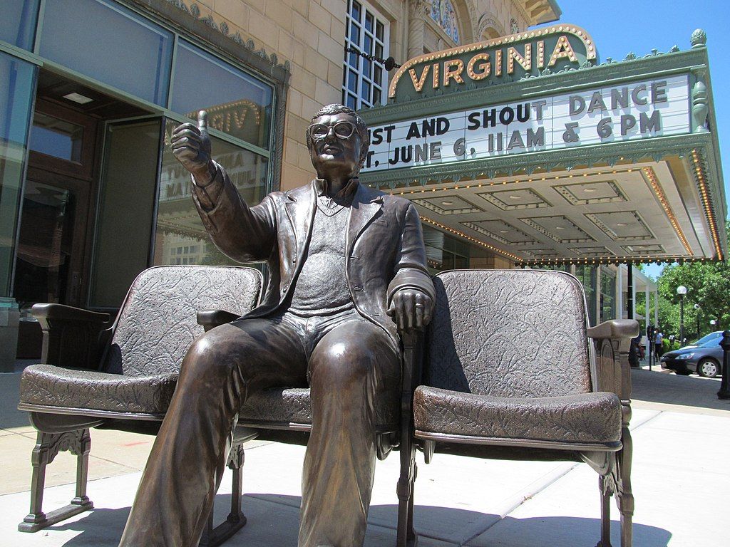 Roger ebert statue on the grounds of Virginia Theatre