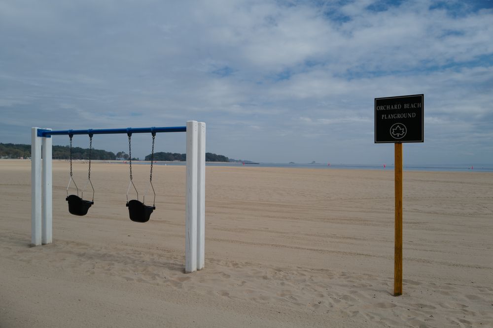 Swingset on Orchard Beach's sand