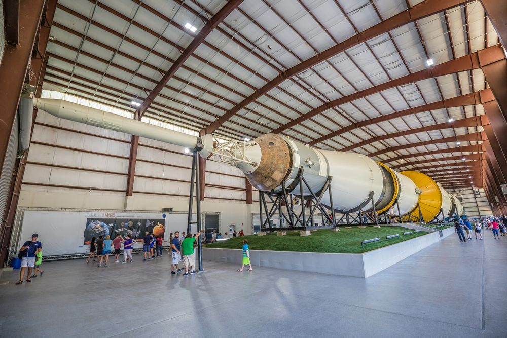 People admiring the JSC Saturn V Rocket