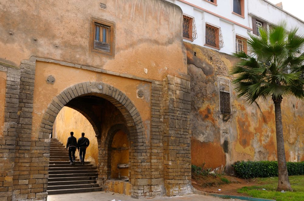 Two men walking along Old Medina