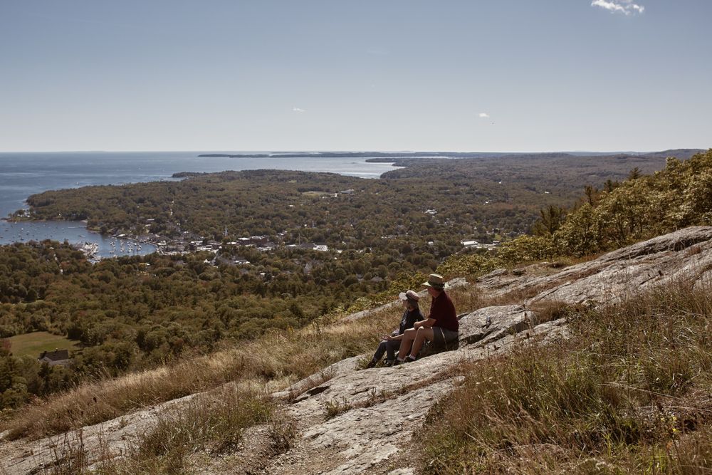 Tourists admiring the view from Mount Battie and Camden Hills State Park
