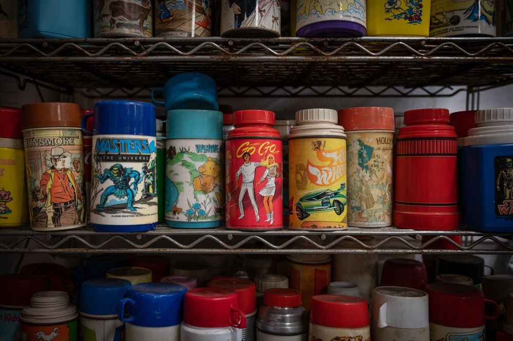 Shelves of vintage thermos at the Lunchbox Museum