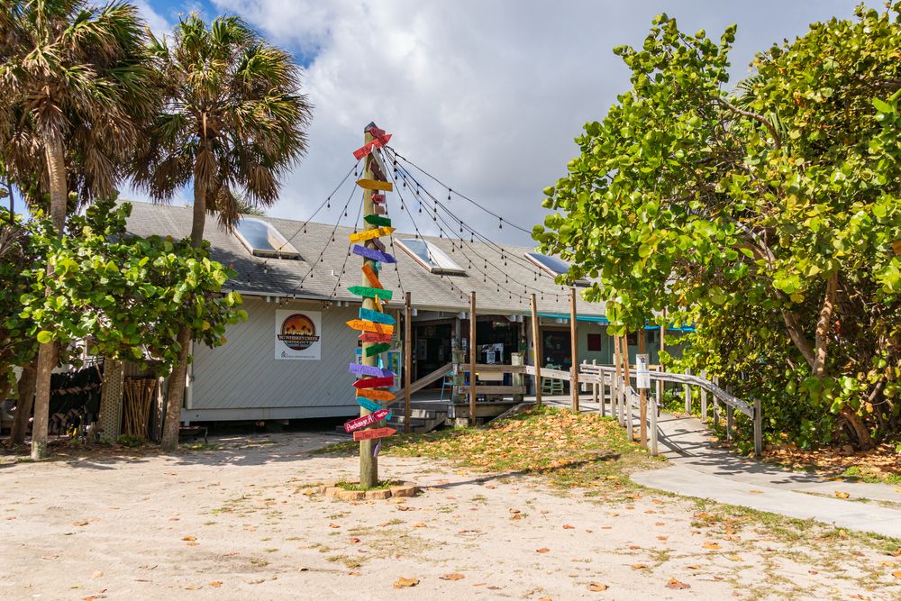 Colorful arrows pointing to different directions in front of the whiskey creek hideout.