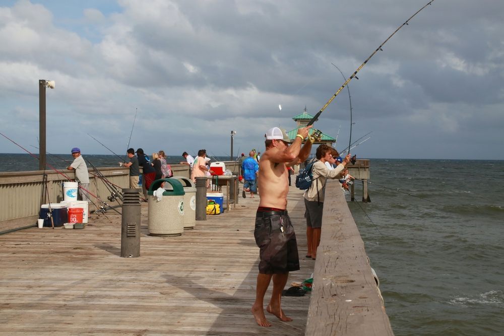 People fishing on Deerfield Beach International Fishing Pier
