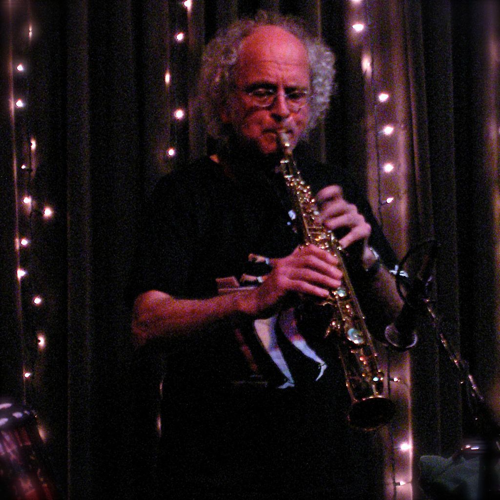 A white-haired man playing saxophone at eddie's attic.