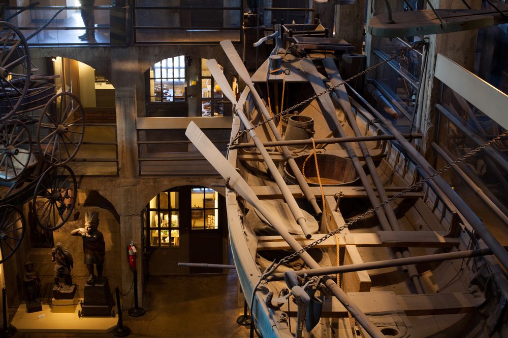 Wooden boat hanging from Mercer Museum's ceiling