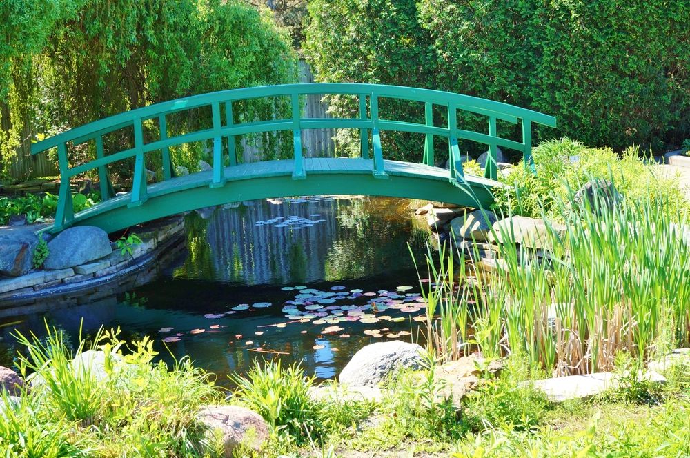 A green footbridge at 4-H Children's Garden.