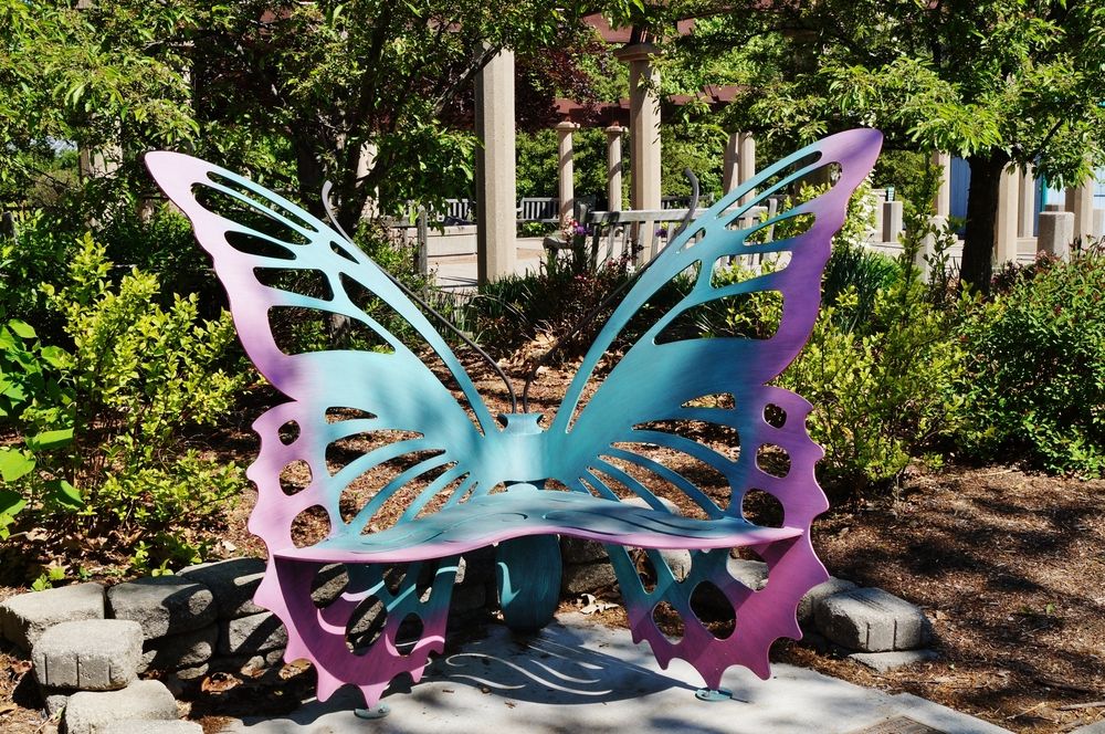 A butterfly shaped bench at 4-H Children's Garden.