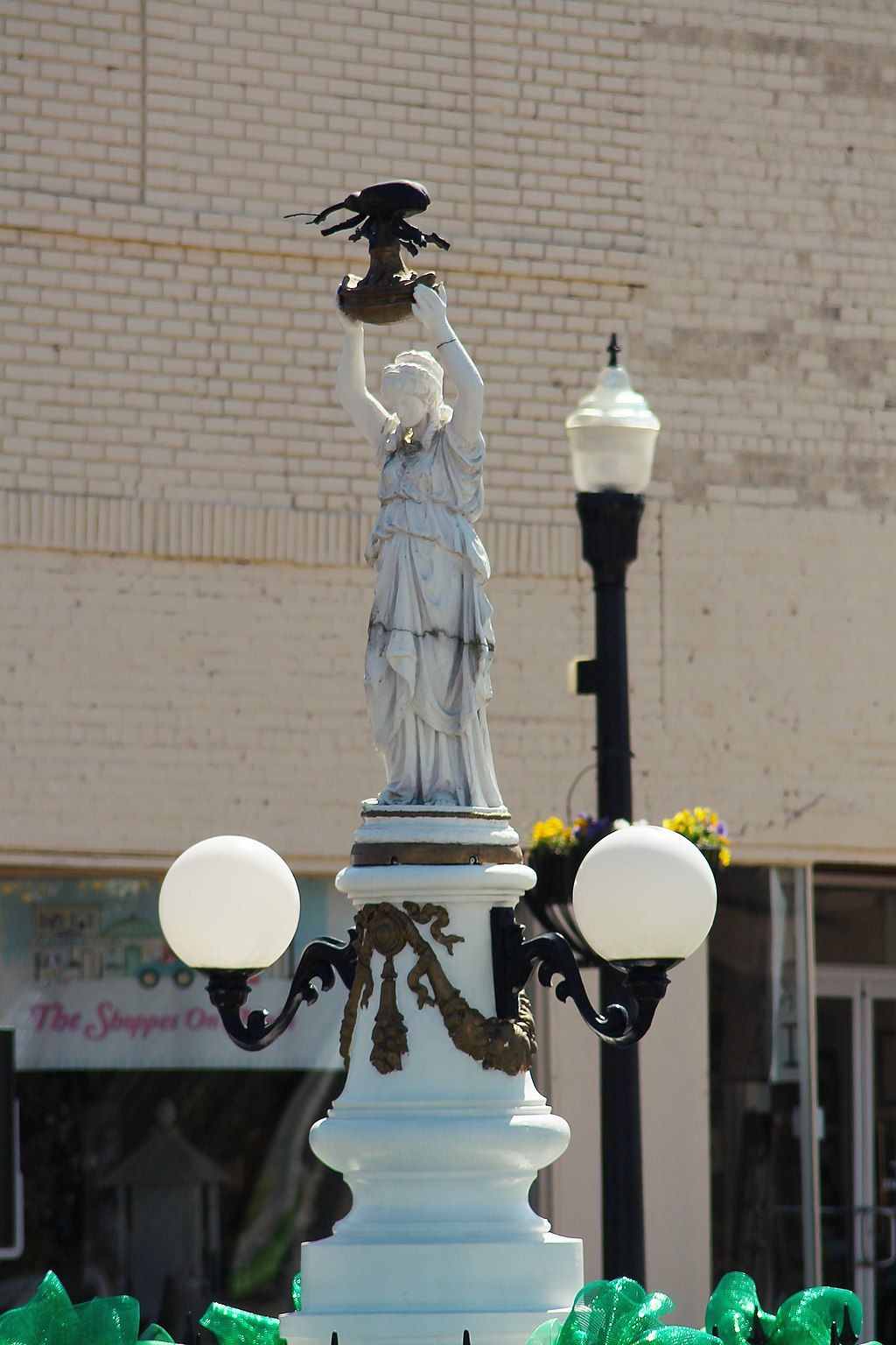 Side view of the Boll Weevil Monument