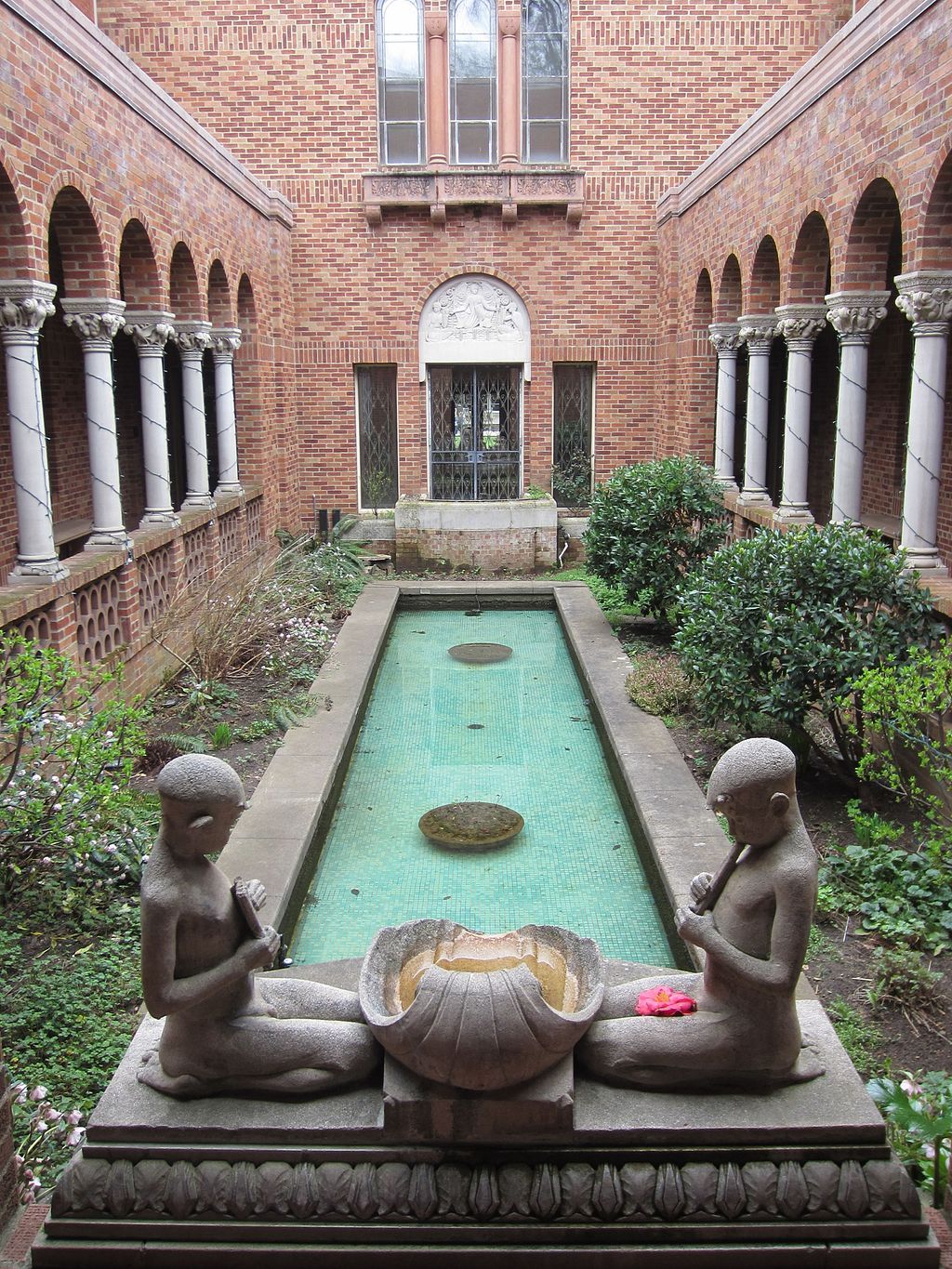 A pond with sculptures in Jordan Schnitzer Museum of Art