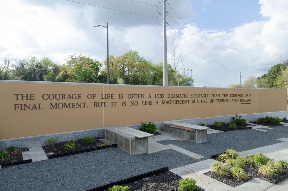 A wall with a quote at North Carolina Veterans Park