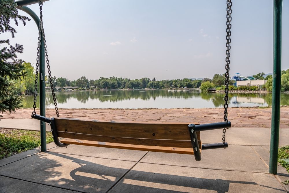 Swing overlooking the waters at Fort Collins City Park