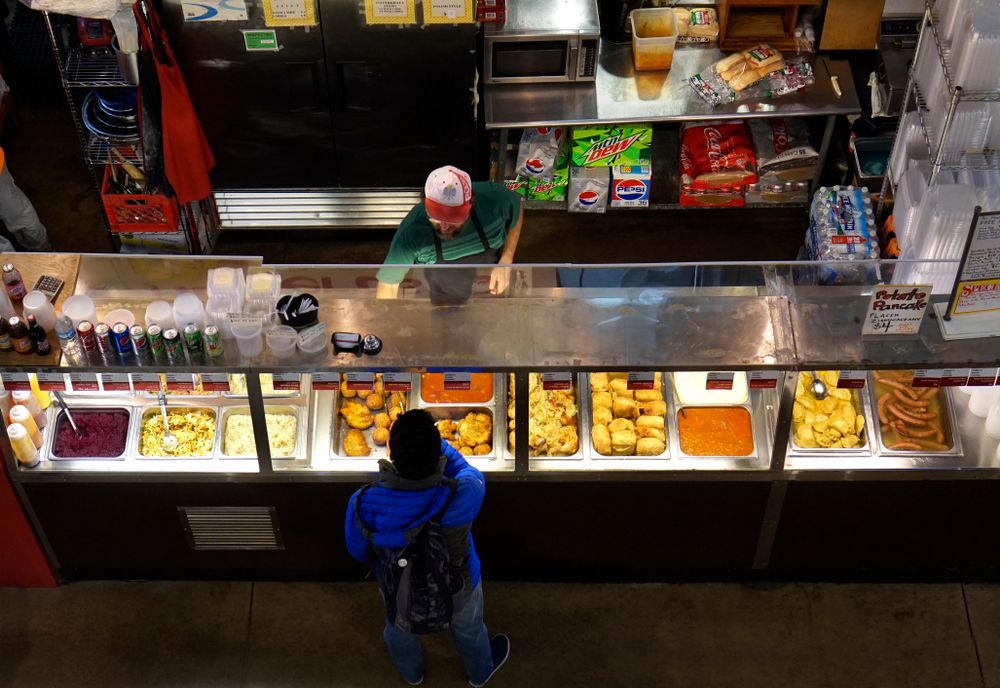 Vendor and shopper in North Market