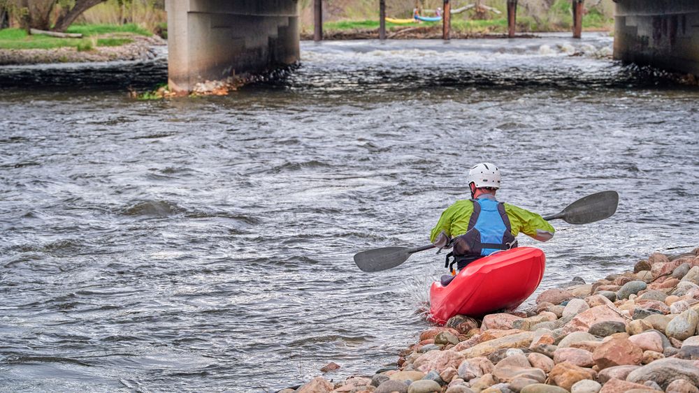 A kayaker on Poudre River Whitewater Park