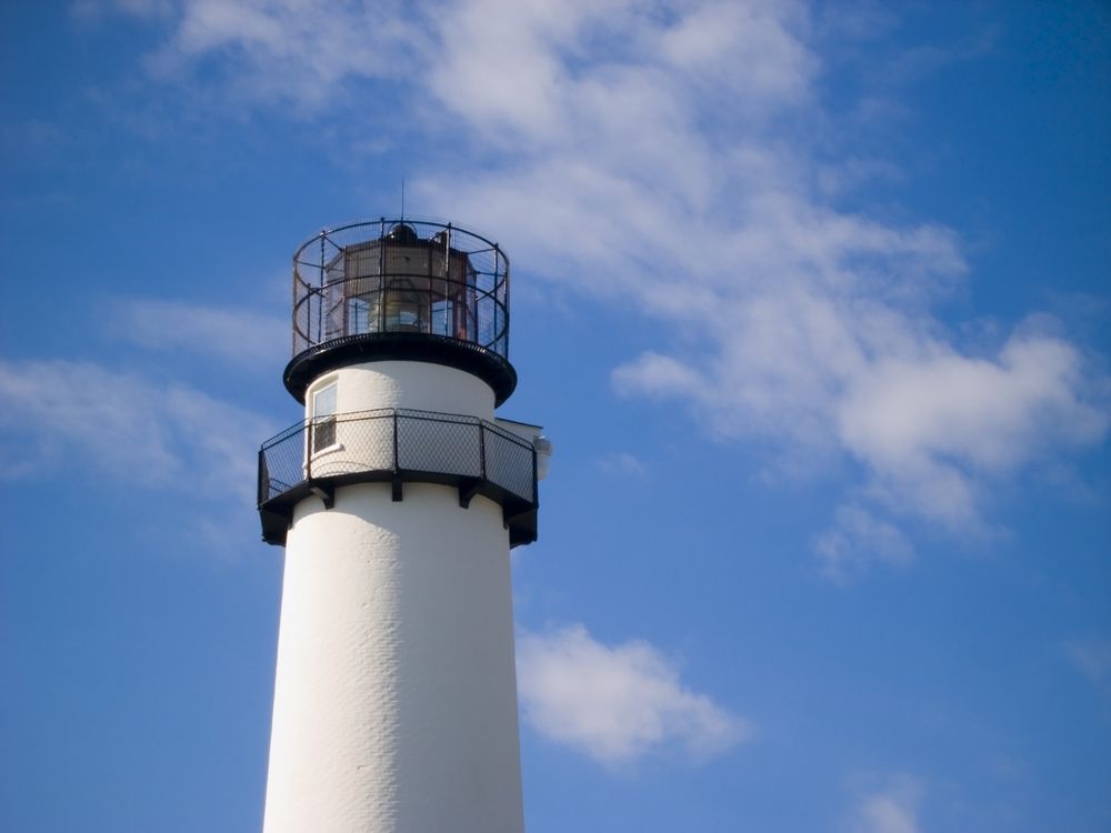 The top half exterior of the fenwick island lighthouse.