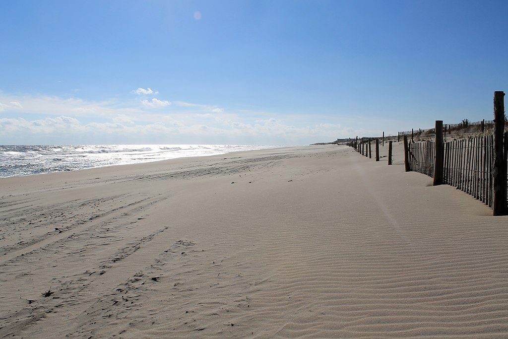 White sands on the empty beach during a sunny day.