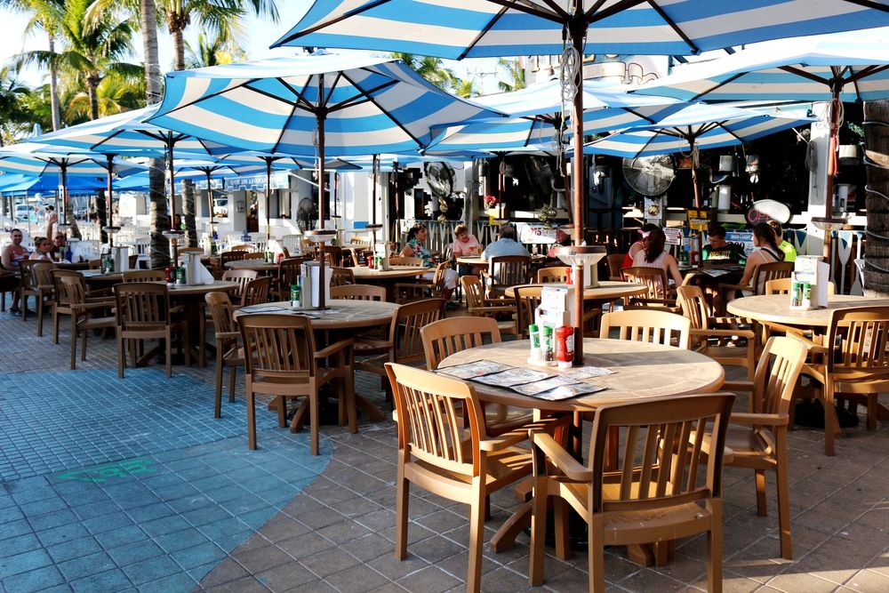 Outdoor dining setup at Times Square at Fort Myers Beach