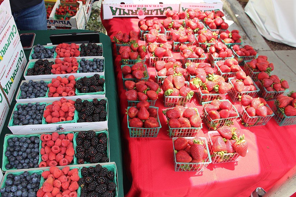 Strawberries and other berries on a table during Strawberry Festival