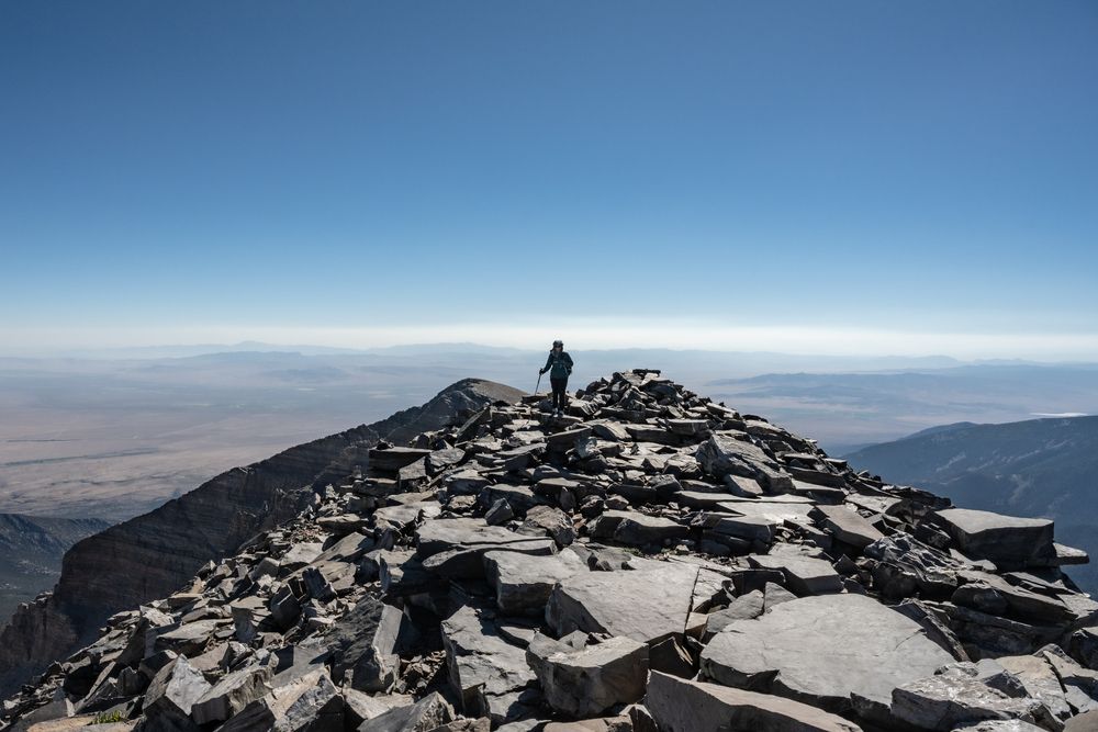 A hiker on Wheeler Peak's rocky summit