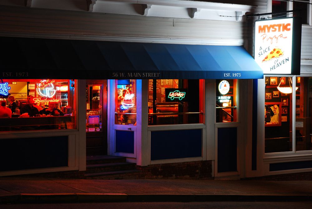 Night view of Mystic Pizza's exterior
