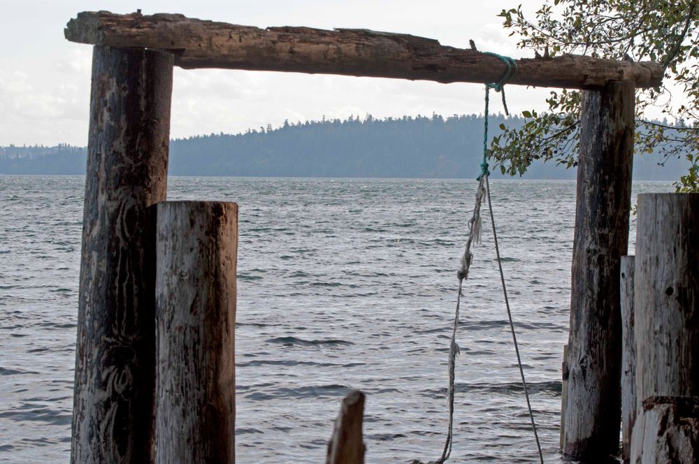 An old wood frame near the waters of sunrise beach park.