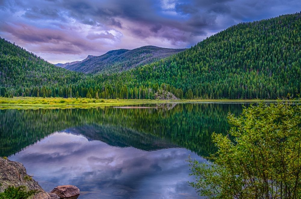 Storm clouds and trees reflecting on Monarch Lake