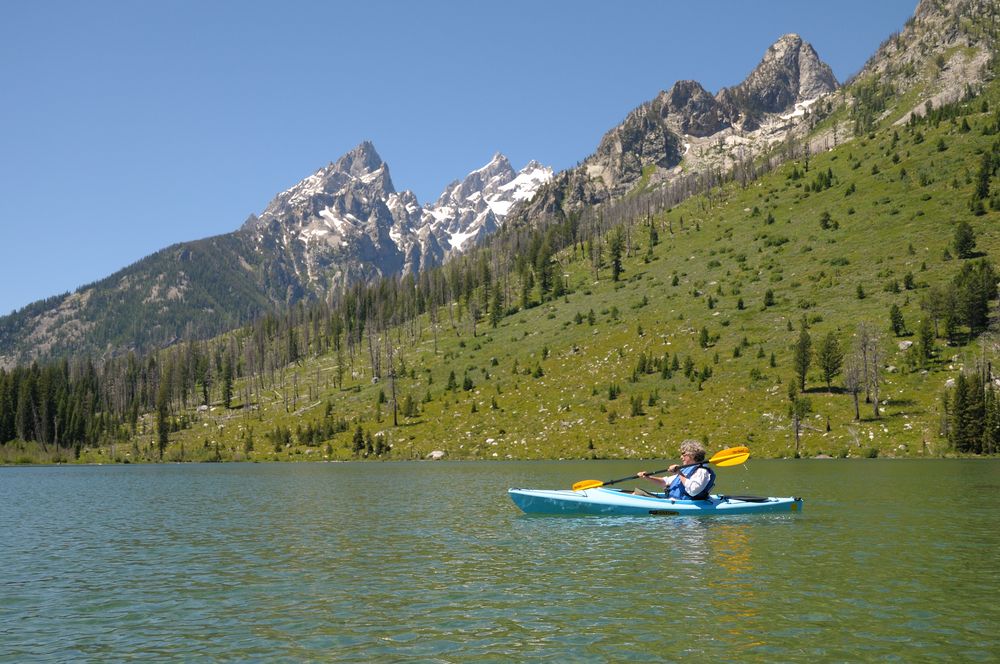 A person kayaking on String Lake