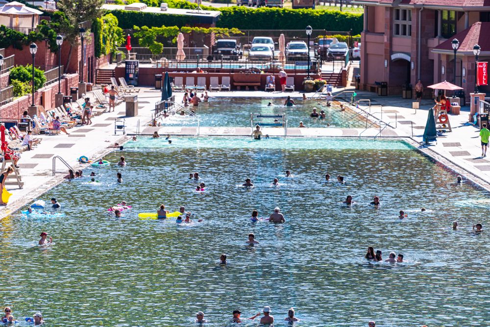 People swimming on Glenwood Hot Springs Resort's pool