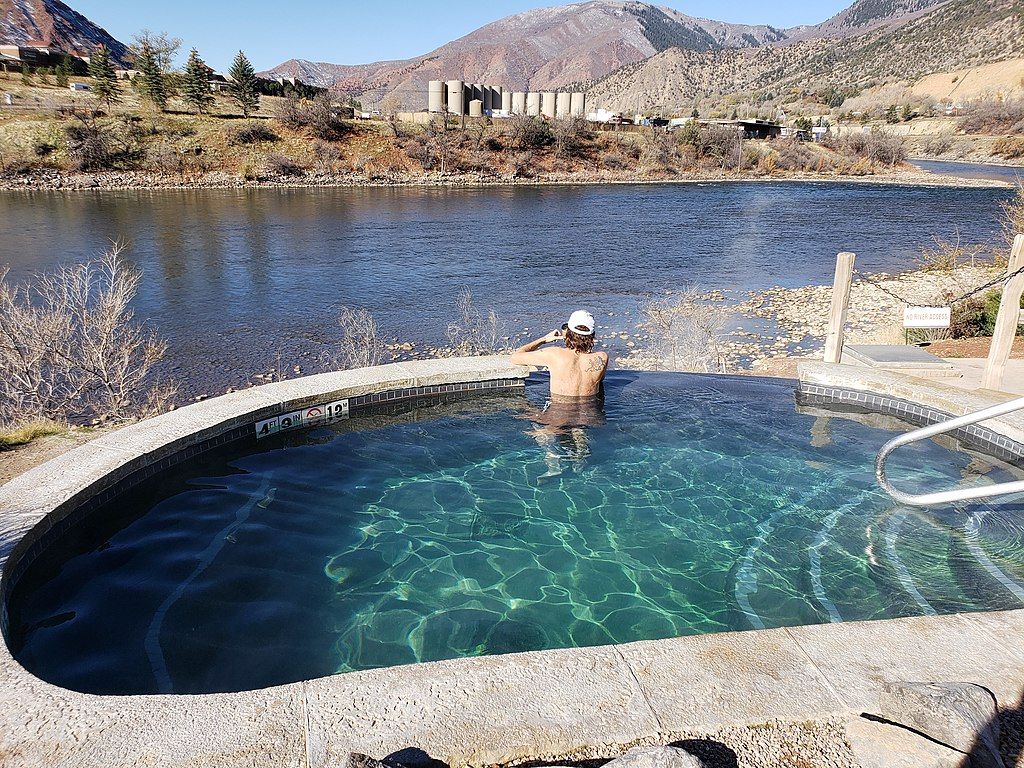 A person swimming on Iron Mountain Hot Springs
