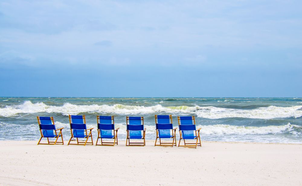 Beach chairs near the waters of Gulf Shores Beach