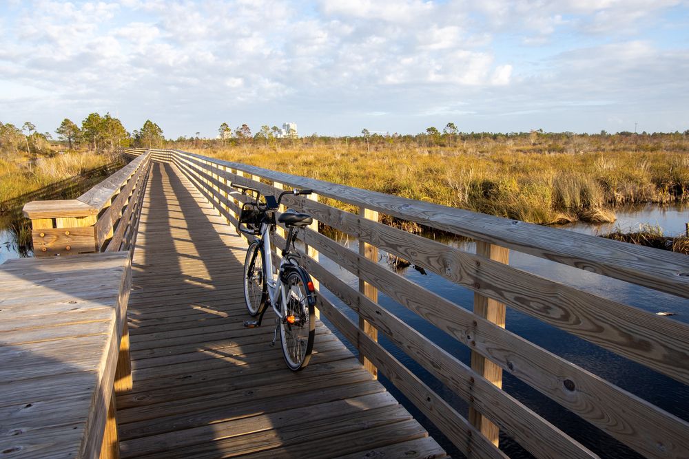 A bike parked on Gulf state park's boardwalk