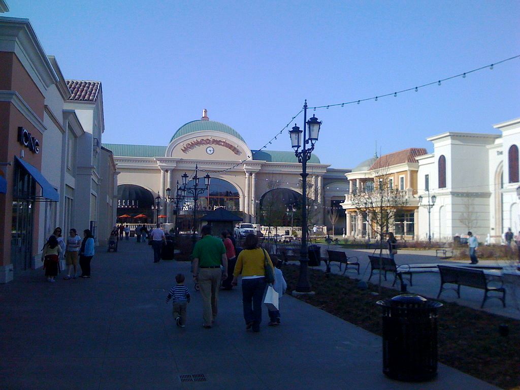 People walking along Bridge Street Town Center