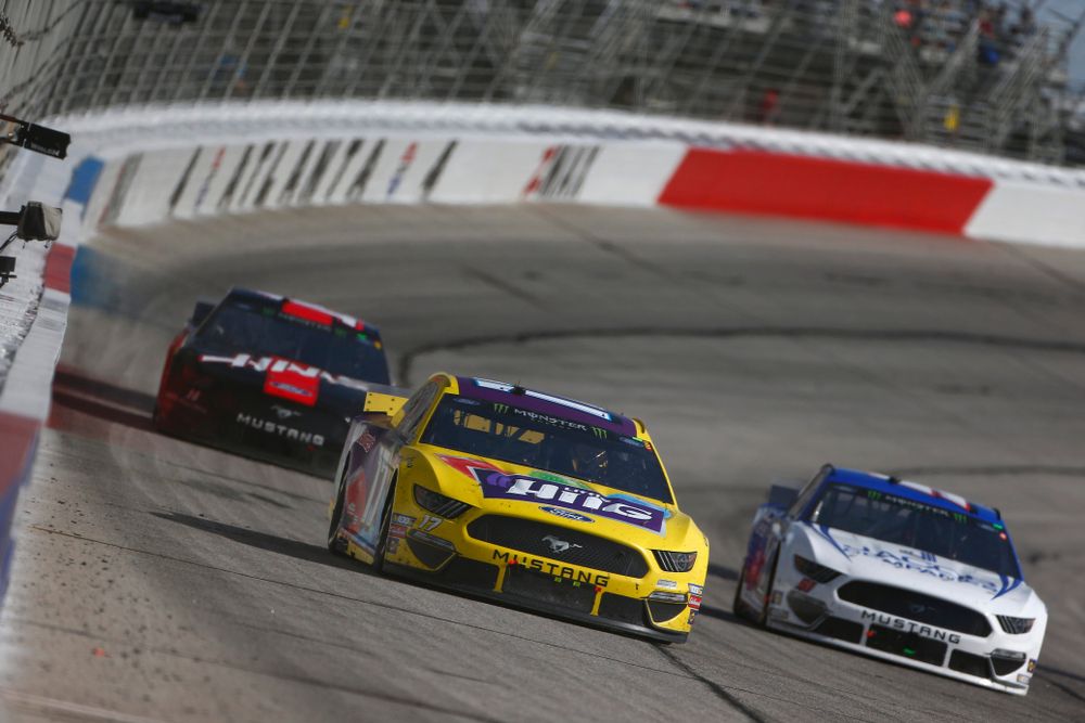 Race cars along Atlanta Motor Speedway