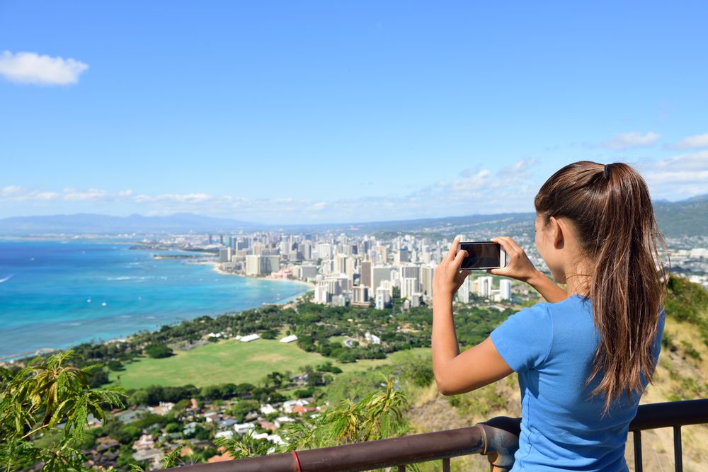 A tourist admiring the view from Diamond Head