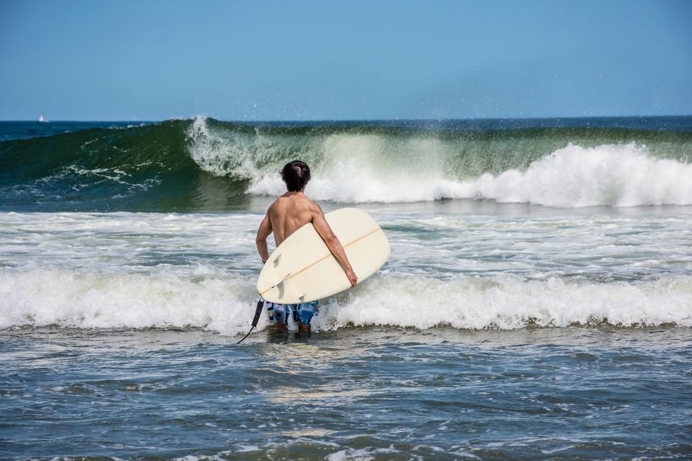 A surfer at Belmar Beach