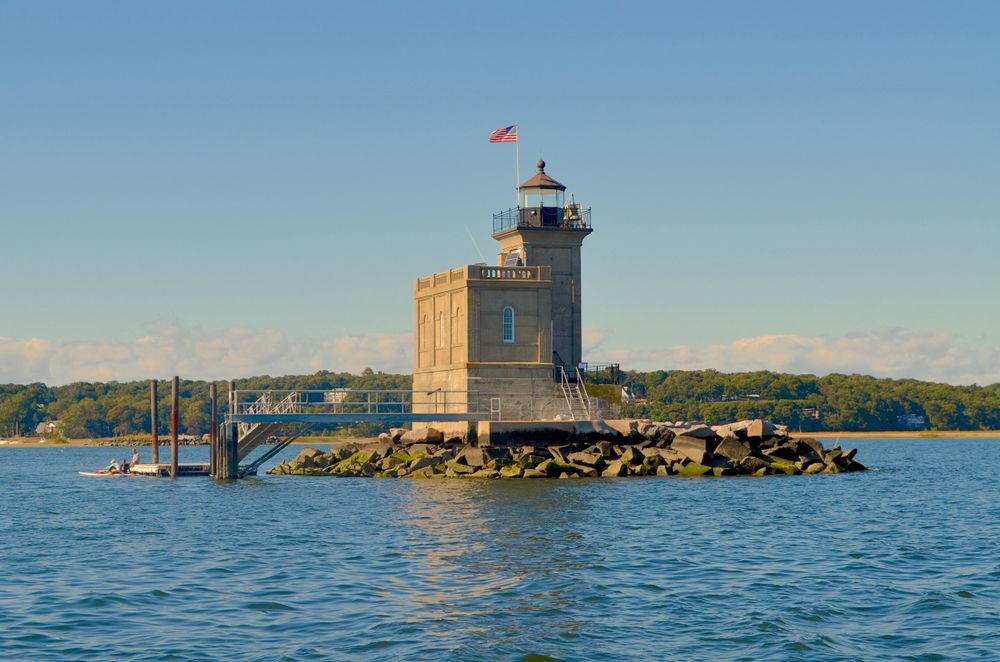 Huntington lighthouse with water surrounding it.