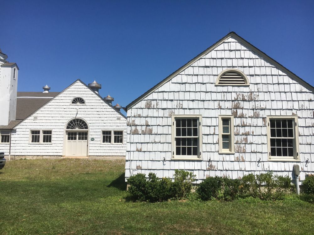 A white colored barn at caumsett park.