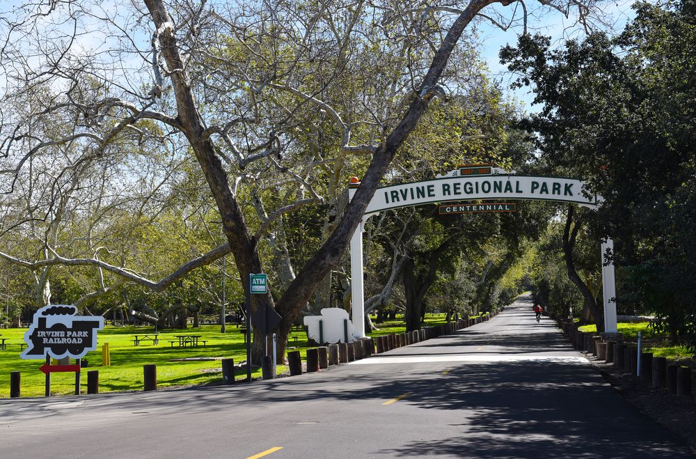 Paved pathway and archway of Irvine Regional Park