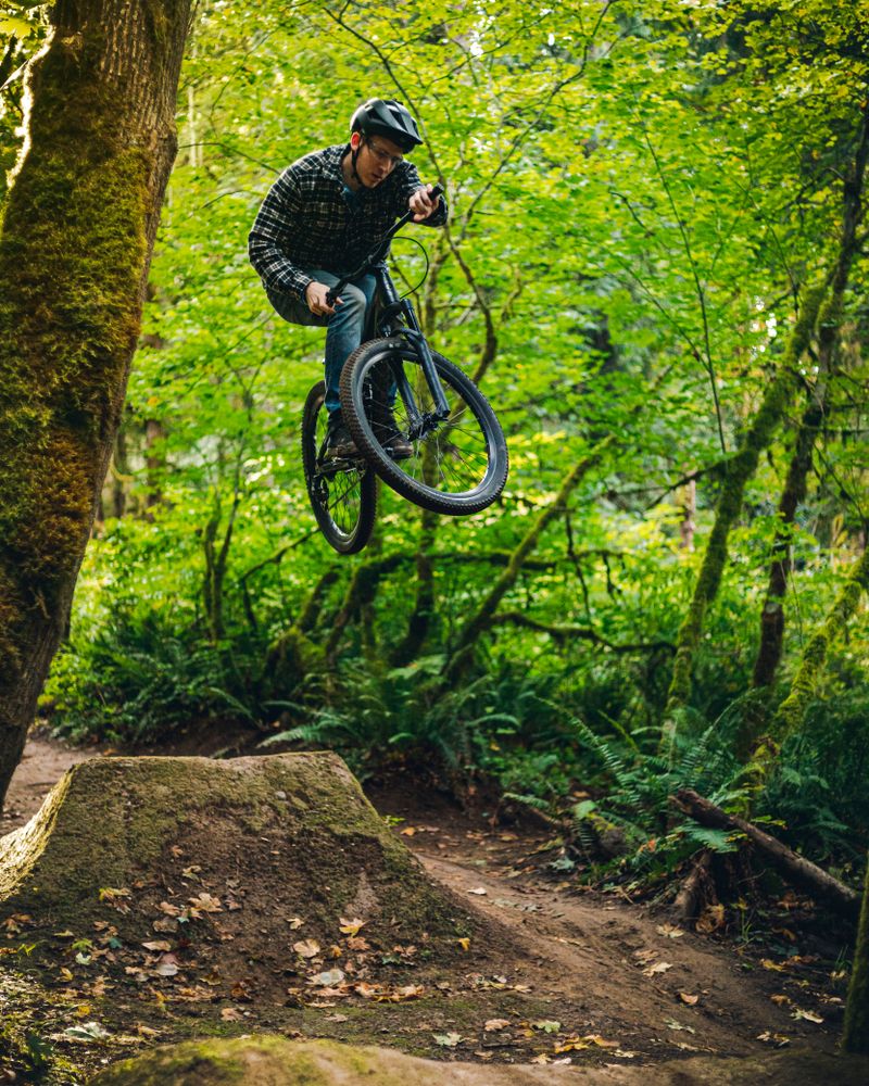 A man riding the bike at Duthie Hill Mountain Bike Park.