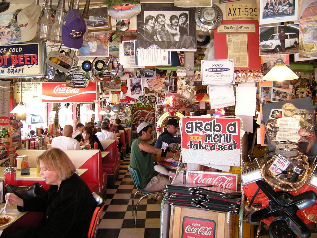 People eating inside Triple XXX Rootbeer Drive-in.