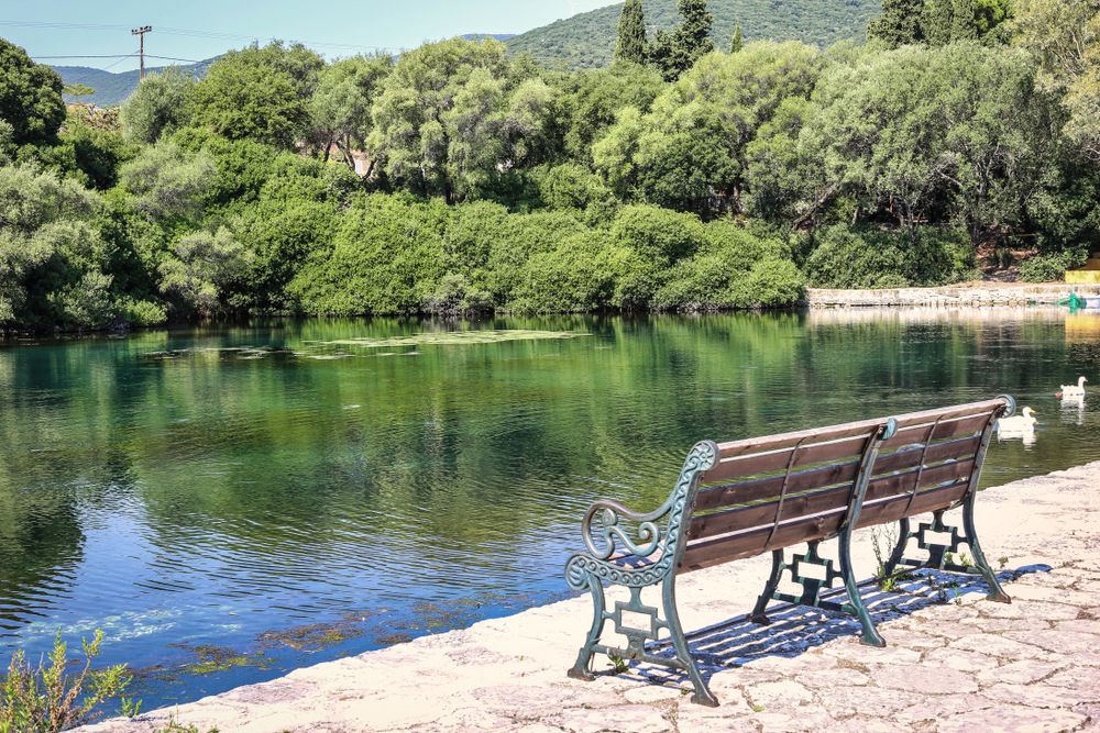 A bench overlooking the Karavomilos Lake